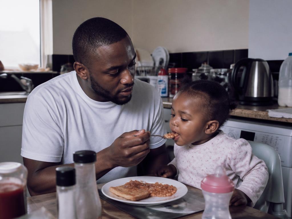 Single Dads sharing a meal with a child